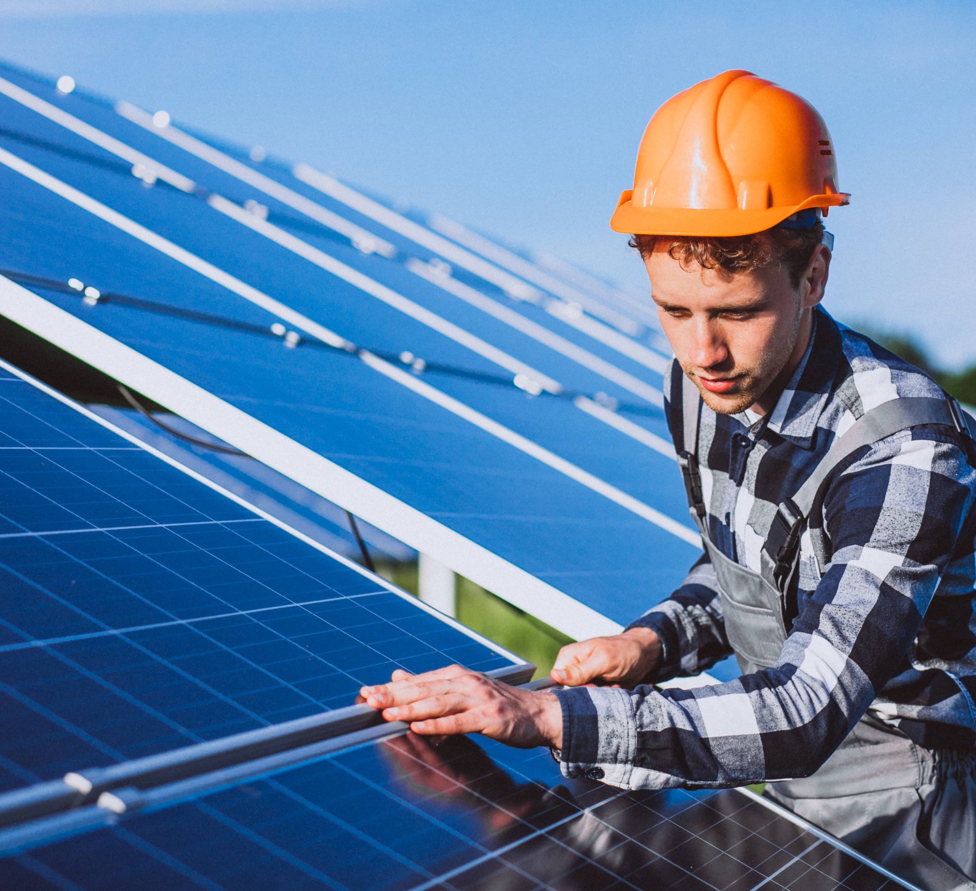 Solar technician installing rooftop solar panels in Florida